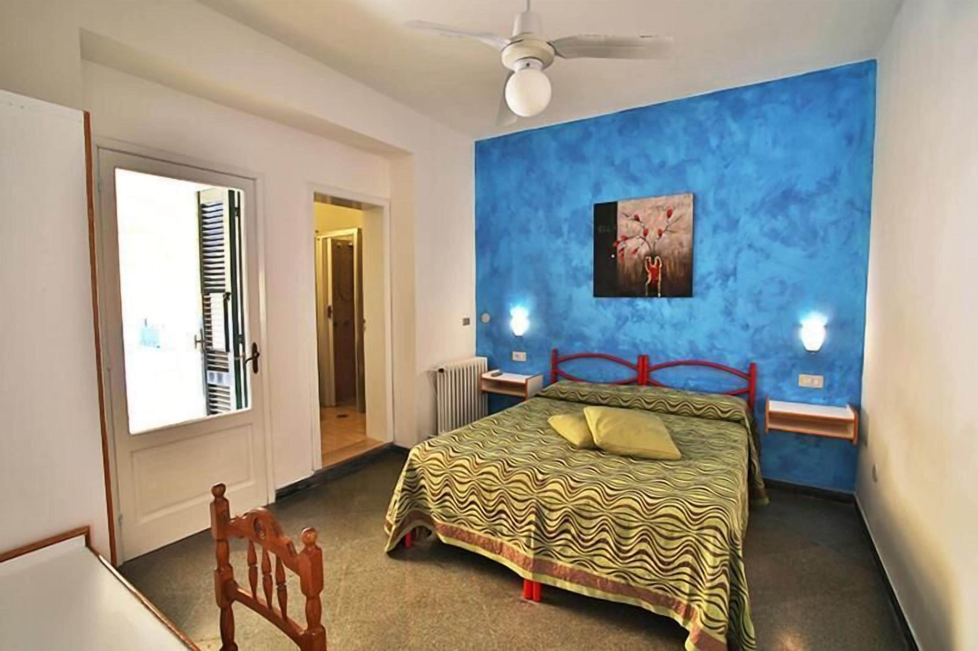 Family Room, Balcony | Minibar, in-room safe, desk, laptop workspace