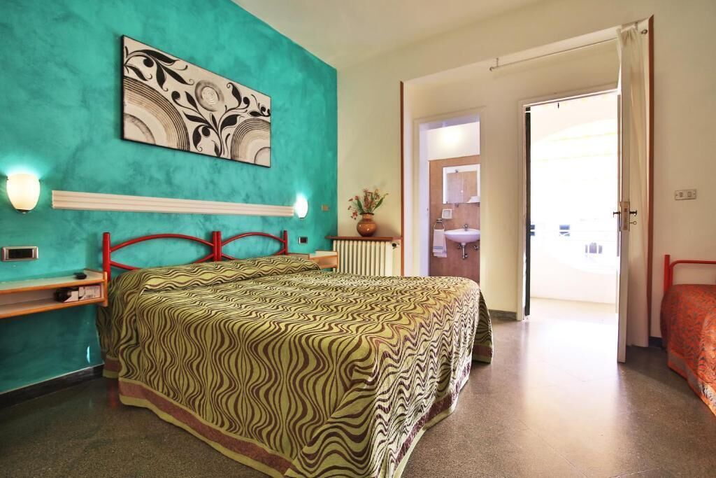 Economy Triple Room | Minibar, in-room safe, desk, laptop workspace