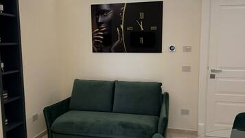 Departamento superior, vista a la ciudad | Área de sala de estar