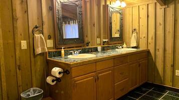 Jetted tub, hair dryer, towels, toilet paper