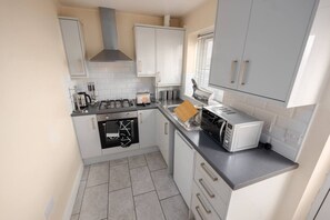 Oven, toaster, cookware/dishes/utensils, dining tables - Modern Family Home Near Liverpool City (Merseyside)