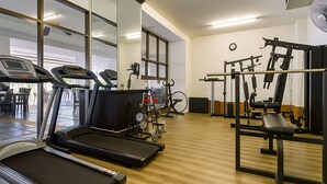 A gym with treadmills, exercise bikes, and weight machines. - 5 Star Resort Patong Beach - Olympic Size Pool, Gym (Patong)