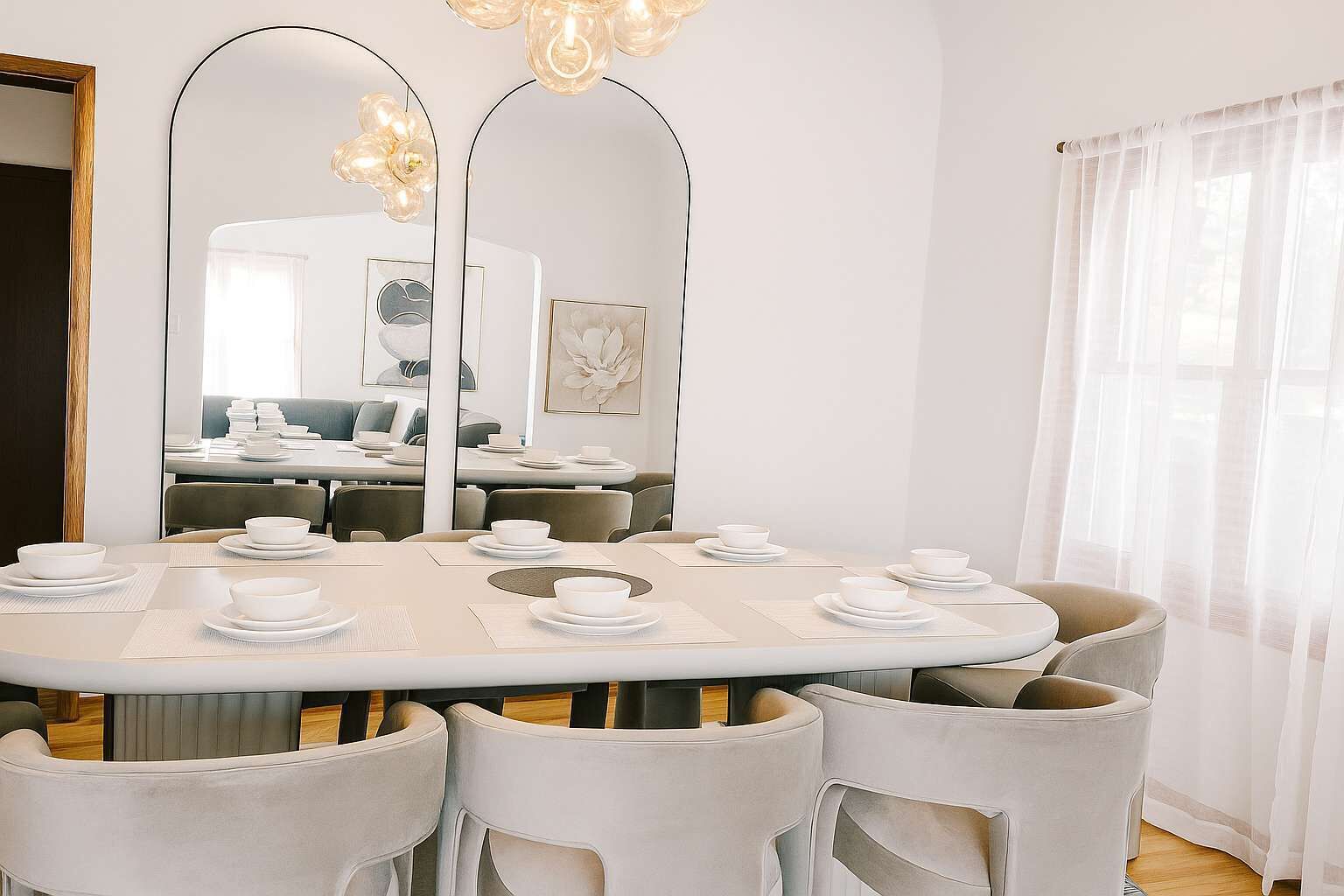 A dining area with a round table set for six, surrounded by six chairs.