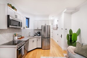 Apartment, 2 Bedrooms | Private kitchen | Full-sized fridge, microwave, oven, stovetop