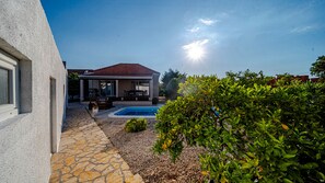 A house with a swimming pool, stone pathway, and lush greenery. - MAB Sweet Home By Villas Guide (Vela Luka)