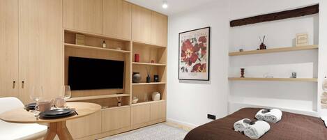 1 bedroom, desk, iron/ironing board, travel crib