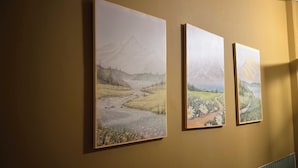 Three framed landscape paintings on a wall. - NOOK INN OLD QUARTER HANOI (Hanoi)
