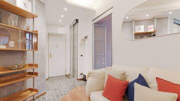 One-bedroom apartment, Passagio Duomo 2 | Living area | 30-inch flat-screen TV with satellite channels