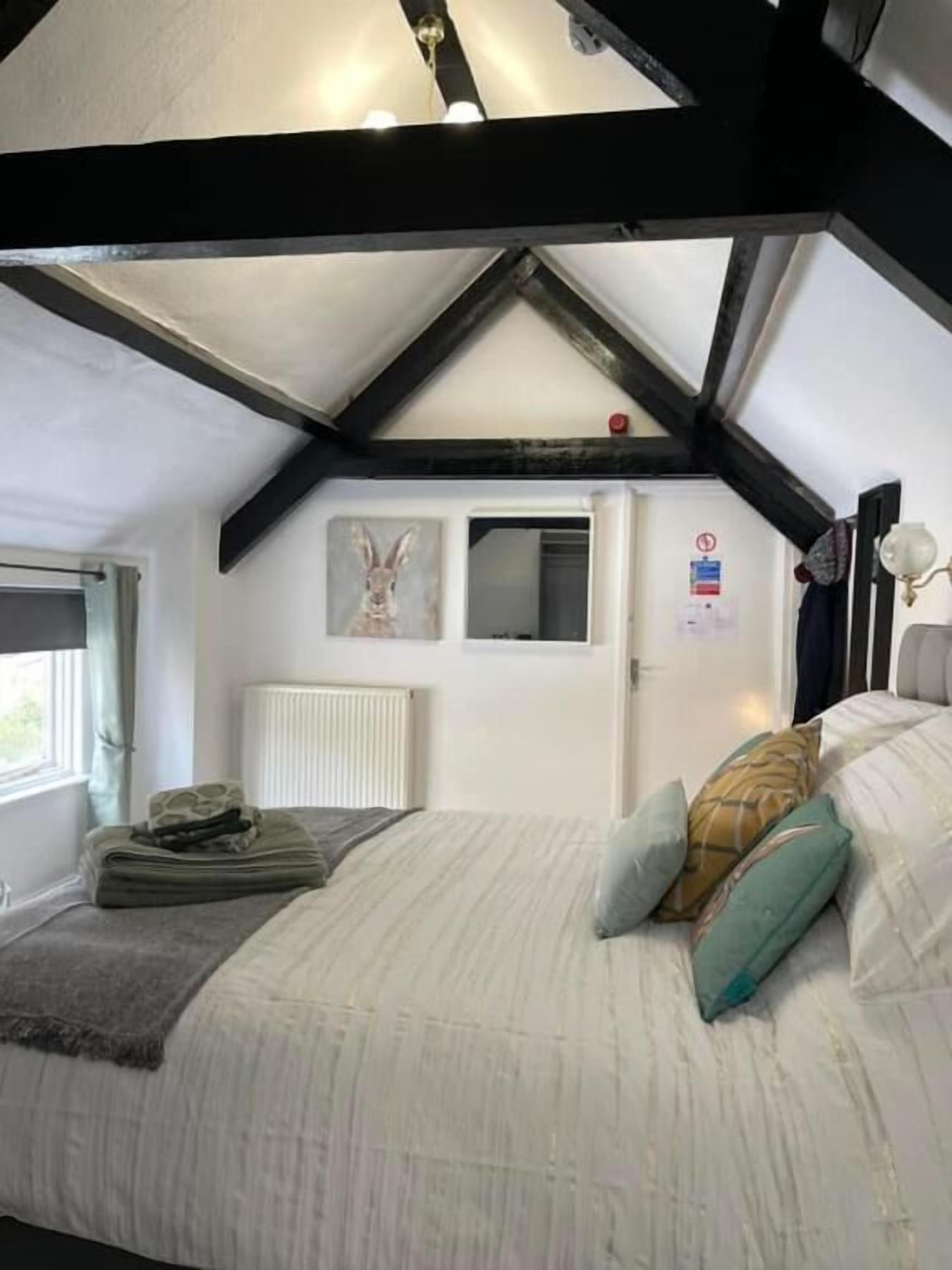 Classic Quadruple Room, Courtyard View | Desk, laptop workspace, blackout curtains, iron/ironing board