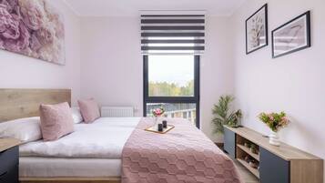 1 bedroom, desk, iron/ironing board, travel crib