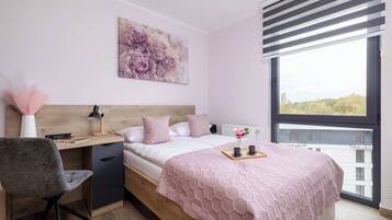 1 bedroom, desk, iron/ironing board, travel crib