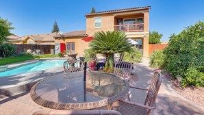 A backyard with a swimming pool, outdoor furniture, and a two-story house. - Outdoor Oasis w/ Fire Pit: Pet-friendly Fresno Gem (Fresno)