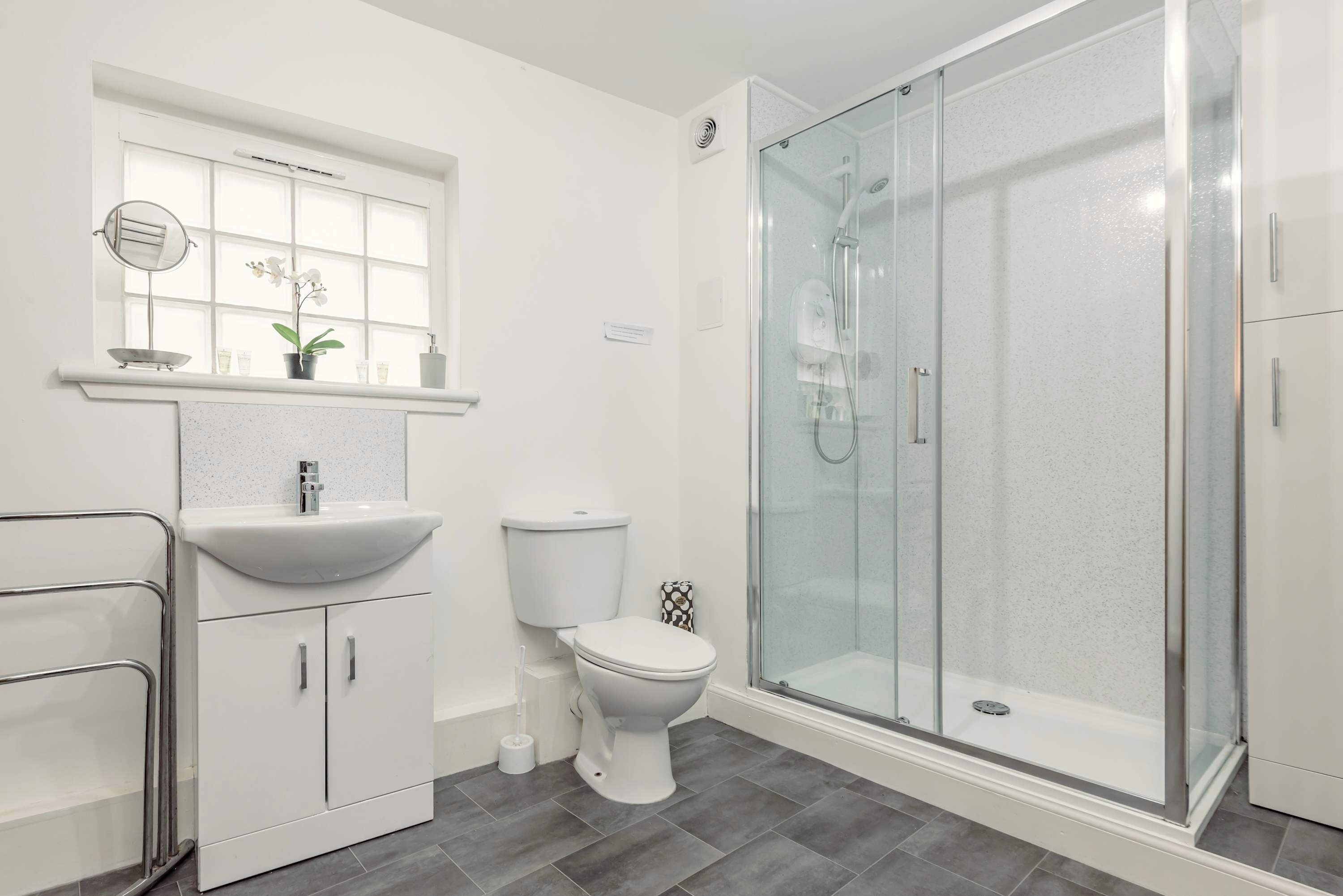 Shower, hair dryer, towels, shampoo