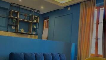 Deluxe Triple Room, City View | Desk, free WiFi