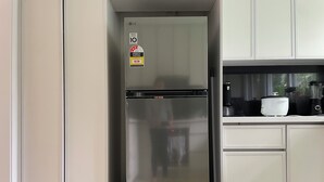 A kitchen with a stainless steel refrigerator, a coffee maker, and a blender on the counter. - Shared house in Marsfield-Bright and Sunny/Bus/Mac Uni/Mac Centre (Marsfield)