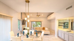 A modern kitchen with a white countertop, a built-in oven, and a large window. - Modern Luxury at Ironwood Country Club Palm Desert (Palm Desert)