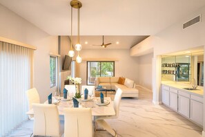 A modern kitchen with a white countertop, a built-in oven, and a large window. - Modern Luxury at Ironwood Country Club Palm Desert (Palm Desert)