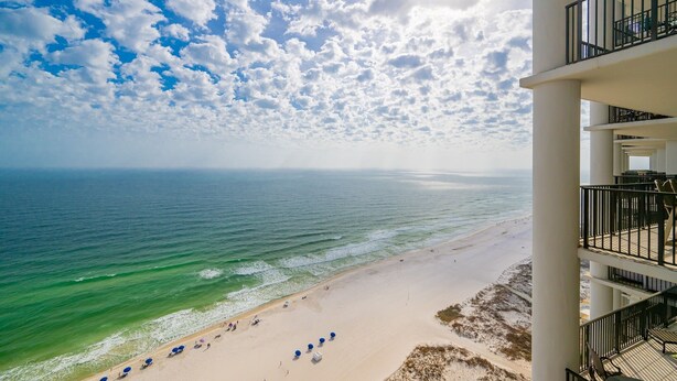 A beachfront hotel with a balcony overlooking the ocean. - The Oasis 2209 Formerly Phoenix West Ii 2209 3 Bedroom Condo (Orange Beach)