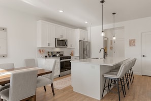 Townhome, 4 Bedrooms | Private kitchen | Fridge, oven, coffee/tea maker, toaster