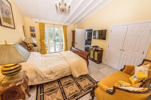 A bedroom with a bed, a sofa, a TV, and a wardrobe. - Maison de la Queste - Four Bedroom Villa, Sleeps 8 (Sainte-Maxime)