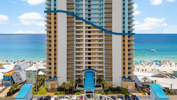 A multi-story hotel with a pool area and beach view. - 4TH FLOOR! GREAT DECOR! OUTSTANDING VIEWS! (Panama City Beach)