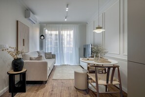 Classic Apartment, Balcony | Living room | 36-inch Smart TV with satellite channels