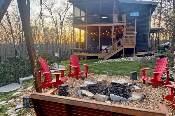 Firepit with chairs and swing.