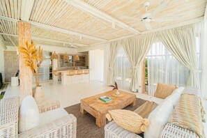 Family Villa, 2 Bedrooms, Patio, Garden View | Living area | TV - Kokomo Villas by Aayan (Kerobokan)