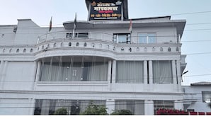 A building with a large signboard, multiple windows, and balconies. - Hotel the Marvellous (Jhansi)