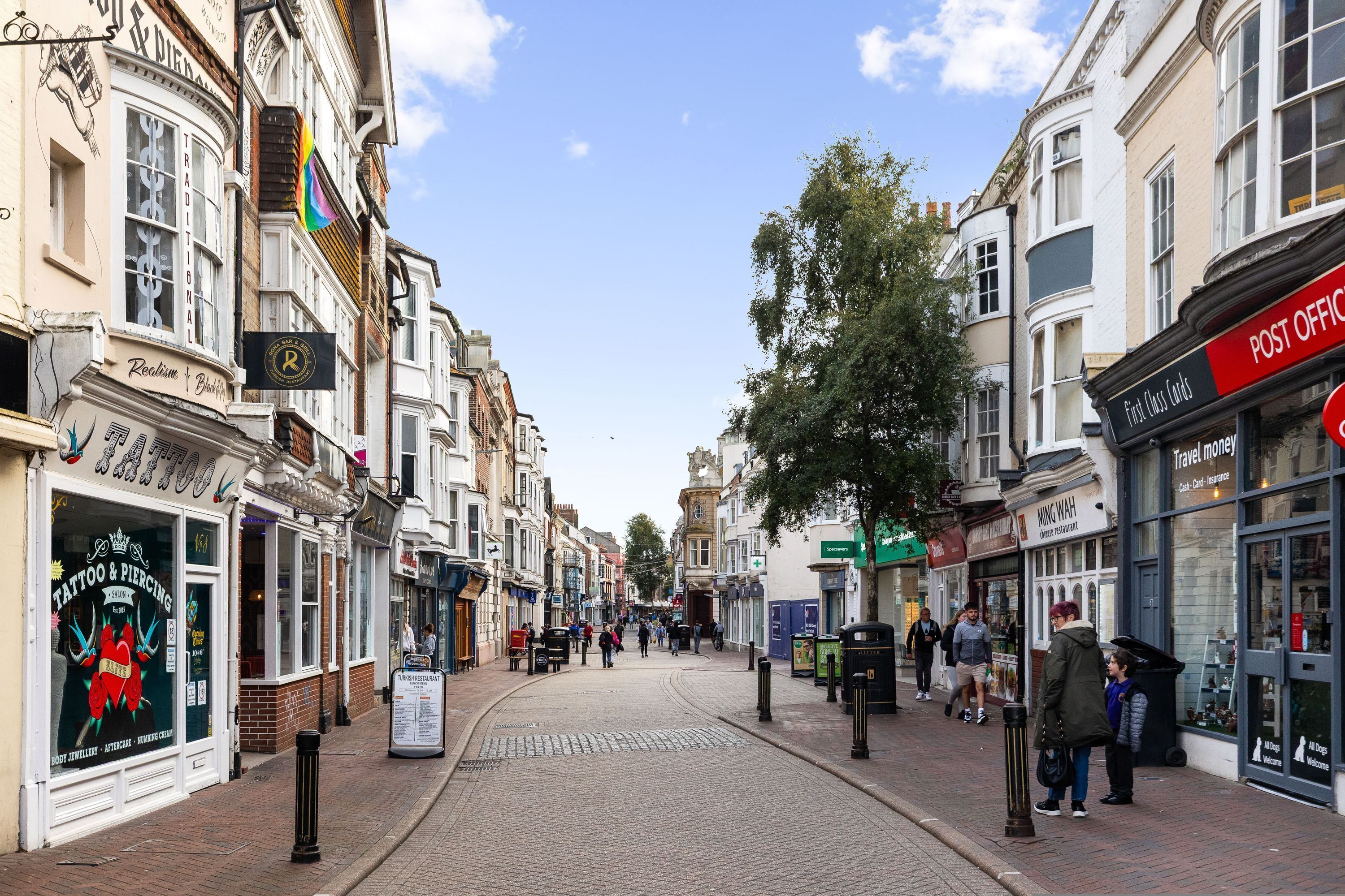 A street with shops and a post office.