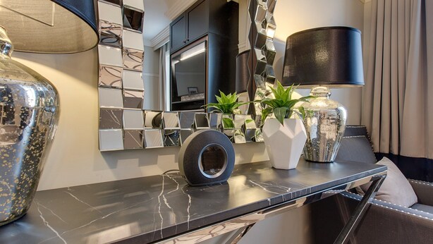A modern kitchen with a marble countertop, a large mirror, and a black lamp. - Family Retreat In Top Blue Mountains Location (Katoomba)