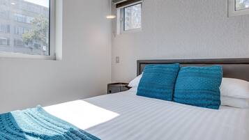 1 bedroom, laptop workspace, bed sheets