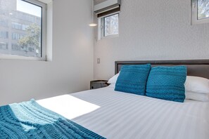 1 bedroom, laptop workspace, bed sheets