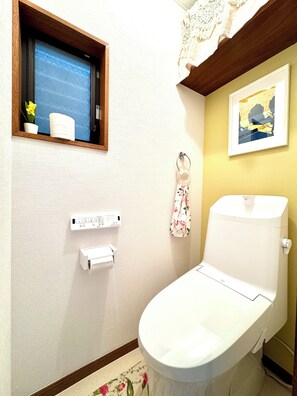 Hair dryer, bidet, towels, soap