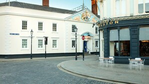A street corner with a white building labeled "TRINITY HOUSE LANE" and a corner shop named "KINGSTON." - 2 Bedroom Marina Suite-203 (Kingston upon Hull)