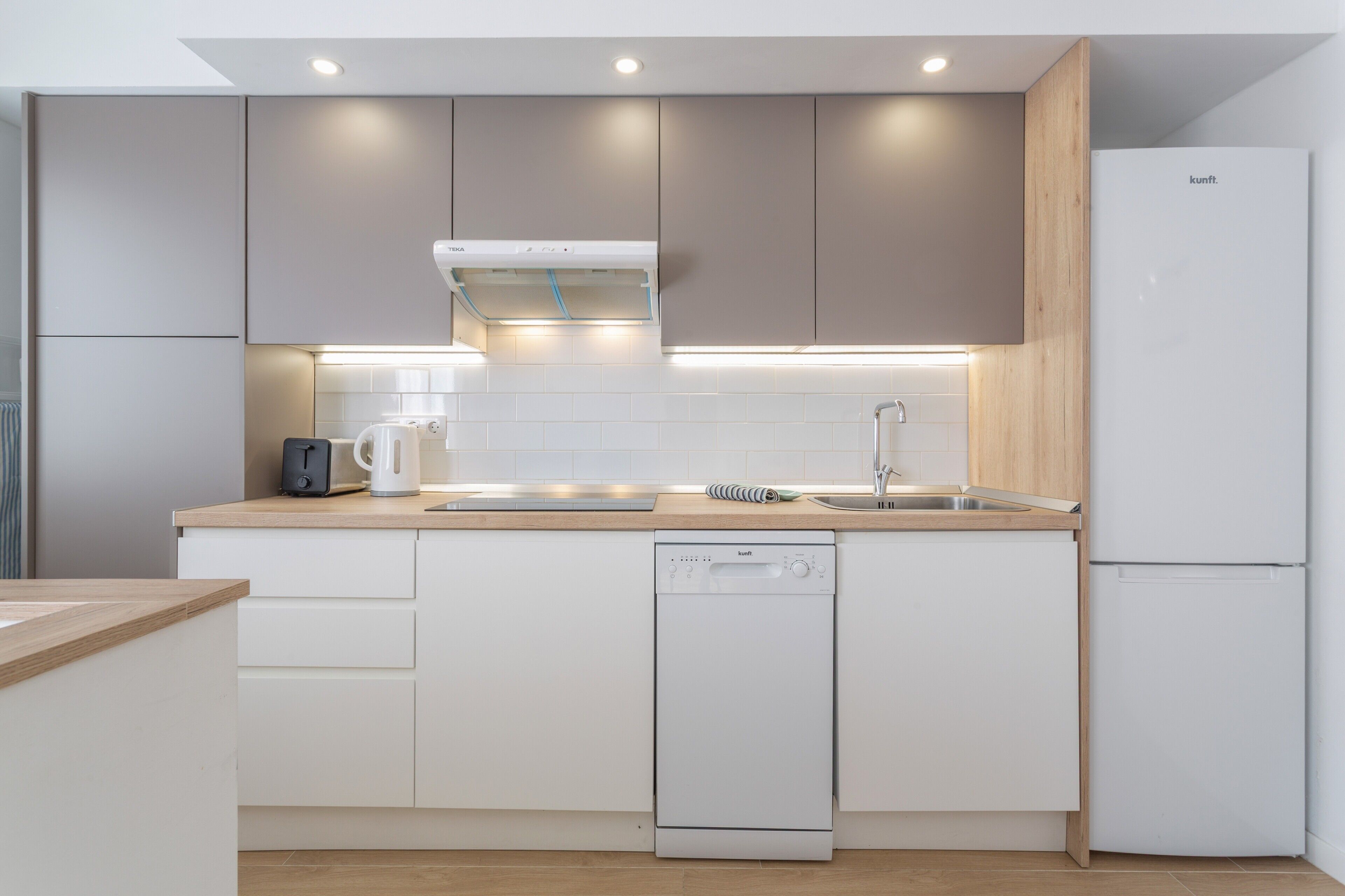 Fridge, stovetop, dishwasher, coffee/tea maker