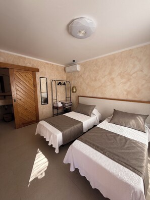 Iron/ironing board, travel crib, free WiFi, bed sheets