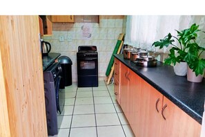 Shared kitchen - Budget Stays At Olivia Pines Guesthouse  (Krugersdorp)