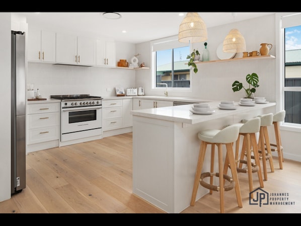 Apartment | Private kitchen | Cookware/dishes/utensils - Elegant Beachside Retreat With Luxurious Amenities (Tomakin)