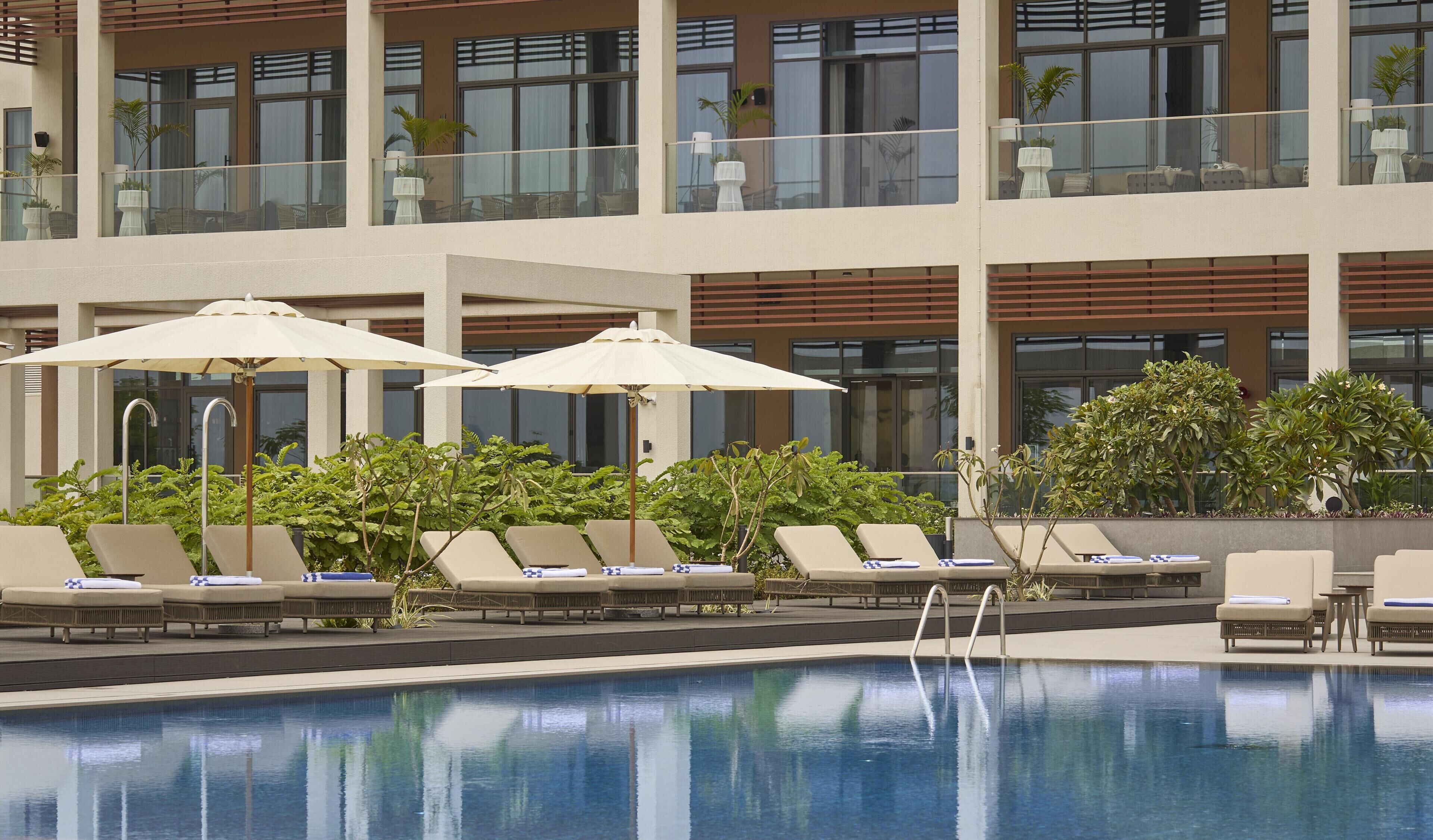 Outdoor pool, pool umbrellas, sun loungers