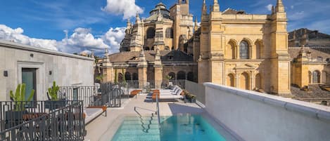 Outdoor pool, pool umbrellas, pool loungers