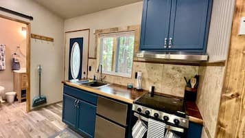 Fridge, coffee/tea maker, cookware/dishes/utensils