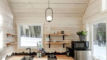 Microwave, stovetop, dining tables