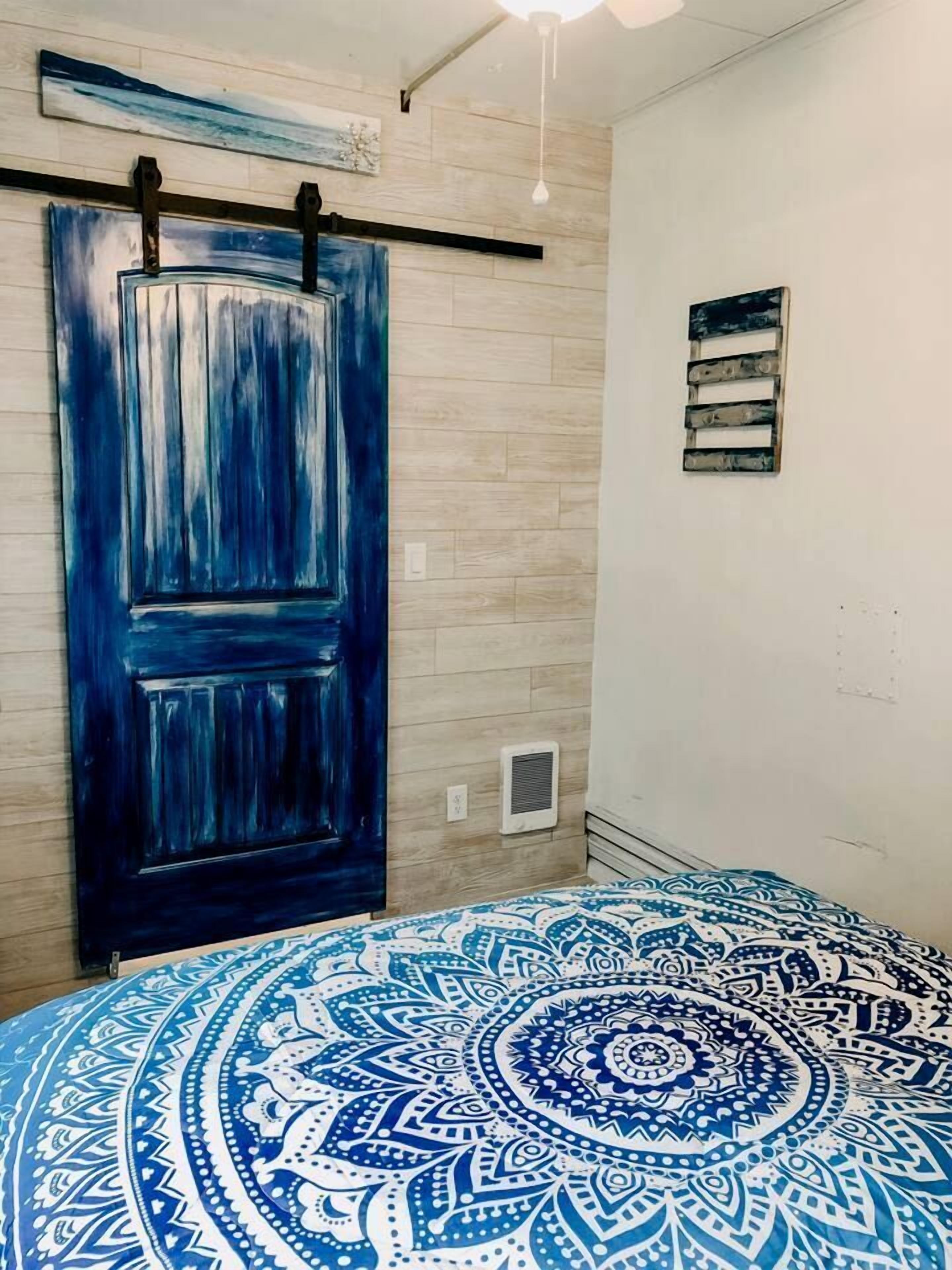 1 bedroom, desk, iron/ironing board, travel crib