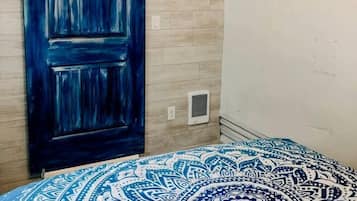 1 bedroom, desk, iron/ironing board, travel crib
