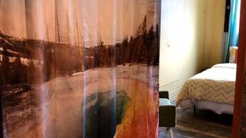 1 bedroom, desk, iron/ironing board, travel crib