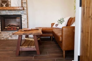 TV, fireplace - Luxurious and Carbon Neutral Hobbit House with Private Hot Tub in Springvale, Maine, Perfect for a Relaxing Weekend Getaway (Sanford)
