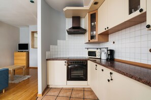 Apartamento, vista para a cidade | Cozinha privada