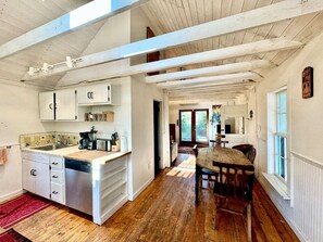 Fridge, stovetop, dishwasher, coffee/tea maker