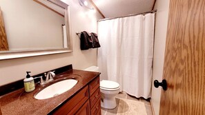 Jetted tub, hair dryer, towels, toilet paper